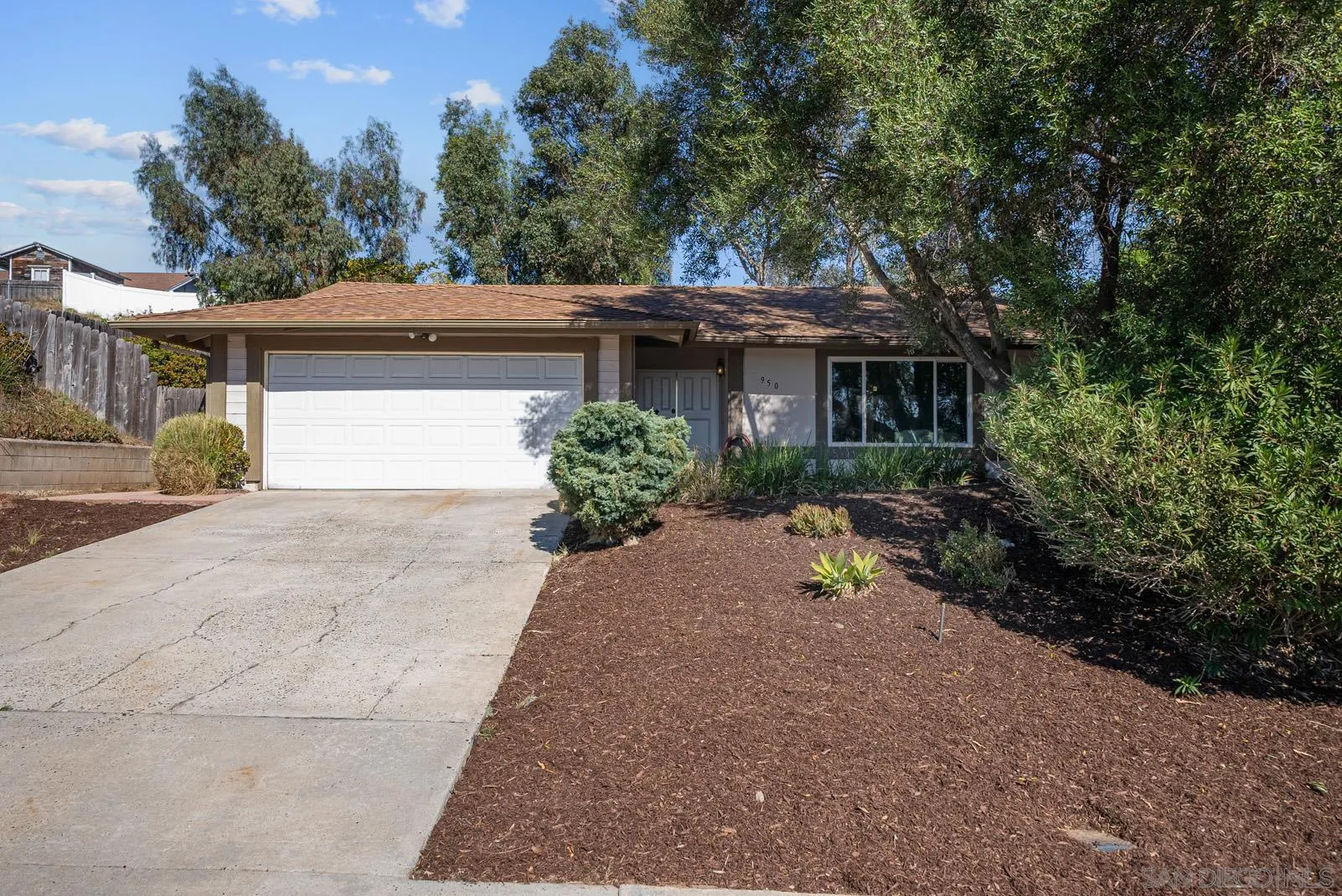 950 East Fallbrook Street Fallbrook, CA 92028 - Photo 4 of 37 a view of house with outdoor space and trees