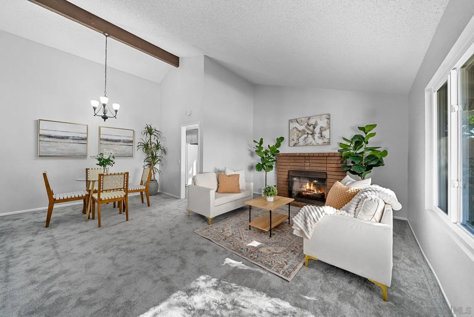 950 East Fallbrook Street Fallbrook, CA 92028 - Photo 7 of 37 a living room with furniture a fireplace and a chandelier