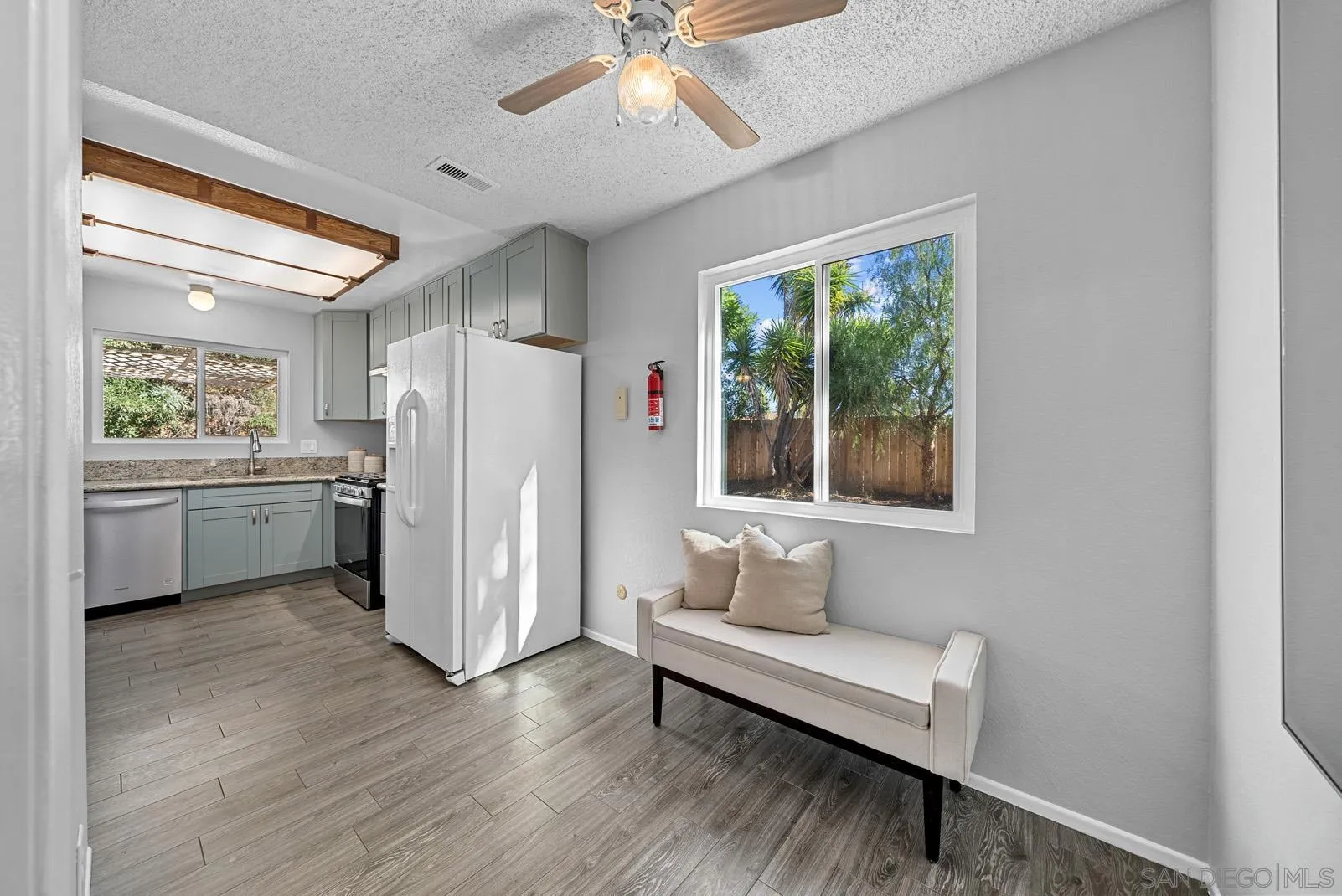 950 East Fallbrook Street Fallbrook, CA 92028 - Photo 10 of 37 a living room with stainless steel appliances kitchen island furniture and a window