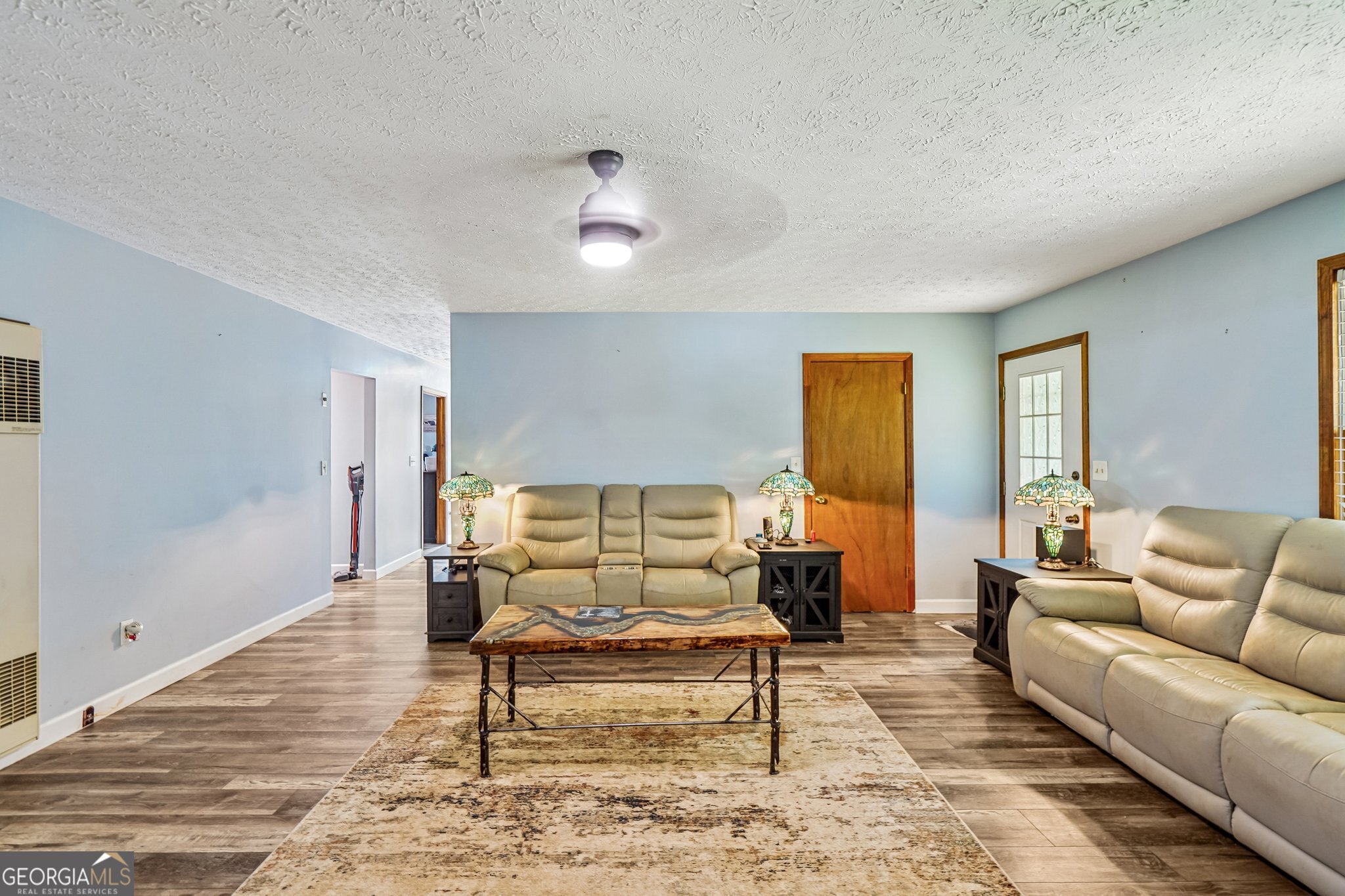 241 Busbin Road Fayetteville, GA 30215 - Photo 10 of 45 a living room with furniture and wooden floor