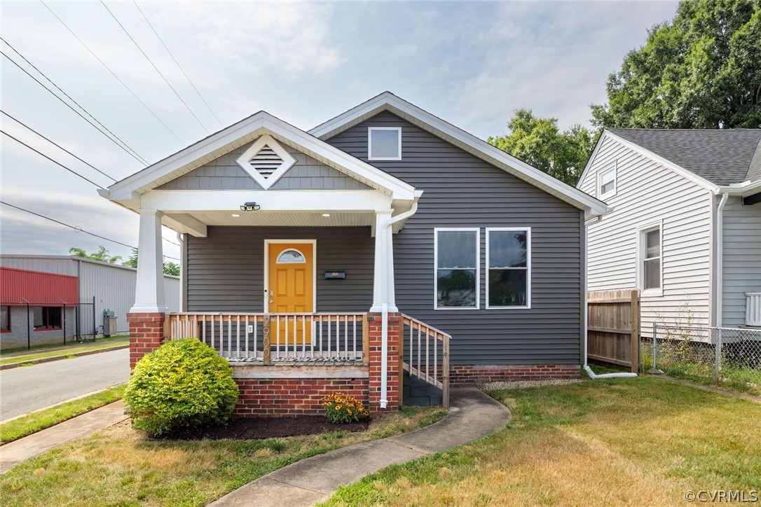 2900 Decatur Street Richmond, VA 23224 - Photo 1 of 35 a front view of a house with a yard