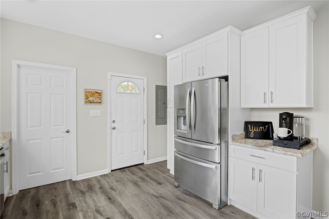 2900 Decatur Street Richmond, VA 23224 - Photo 17 of 35 a kitchen with cabinets stainless steel appliances and a window
