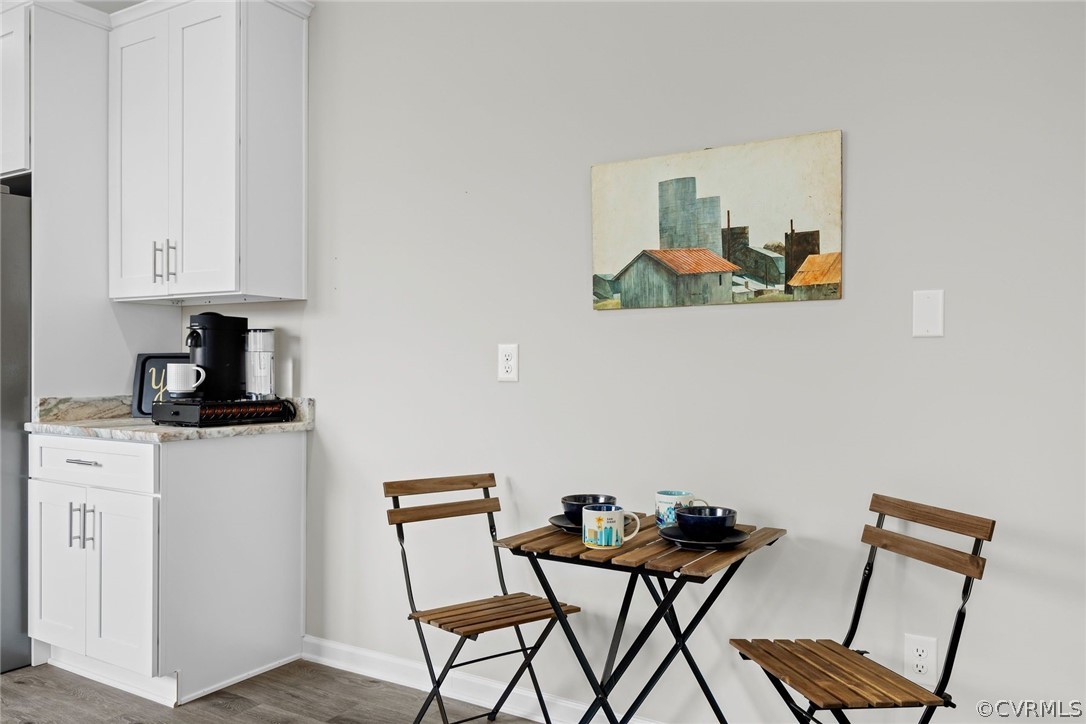 2900 Decatur Street Richmond, VA 23224 - Photo 18 of 35 a view of a workspace with furniture and wooden floor