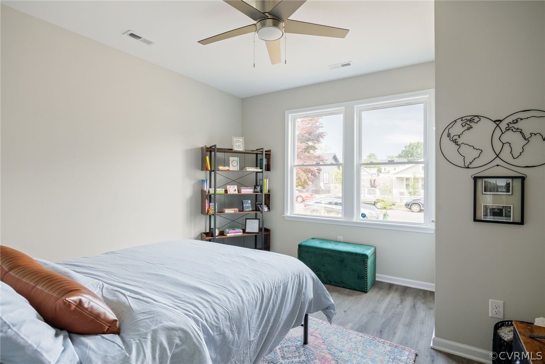 2900 Decatur Street Richmond, VA 23224 - Photo 25 of 35 a bedroom with a bed a window and painting on the wall
