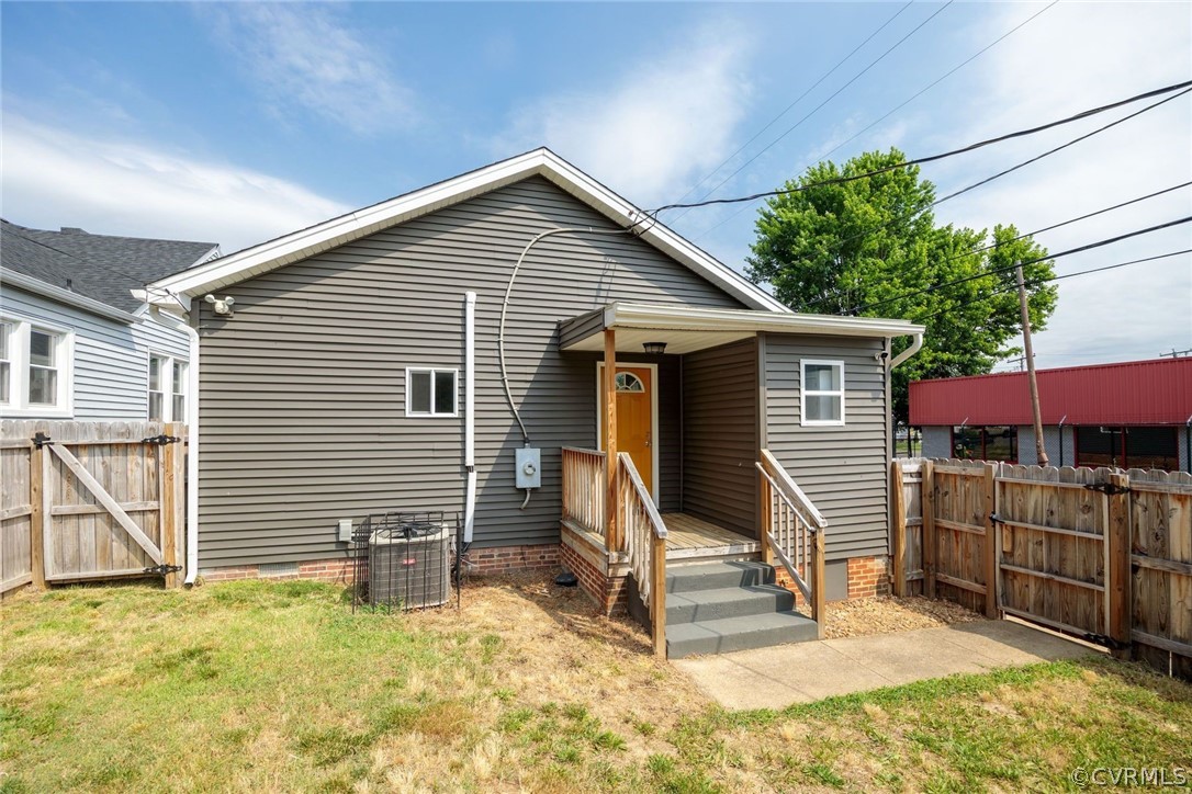 2900 Decatur Street Richmond, VA 23224 - Photo 30 of 35 a view of a house with a yard and wooden fence