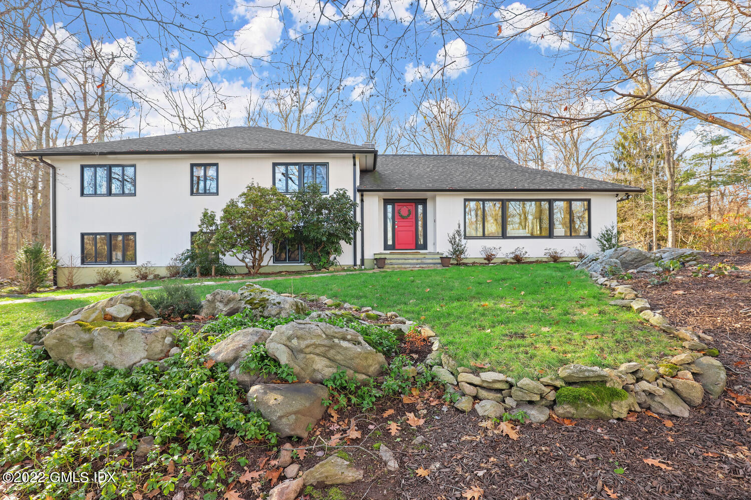a front view of a house with garden