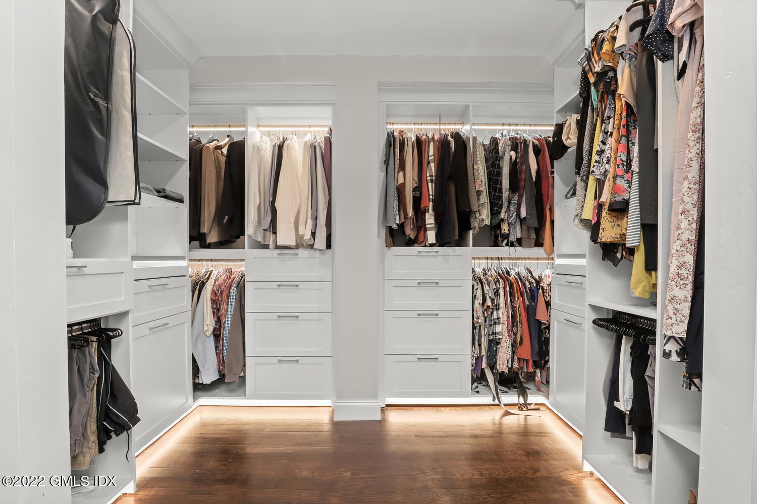 442 Riversville Road Greenwich, CT 06831 - Photo 13 of 29 a view of walk in closet with clothes and shoes