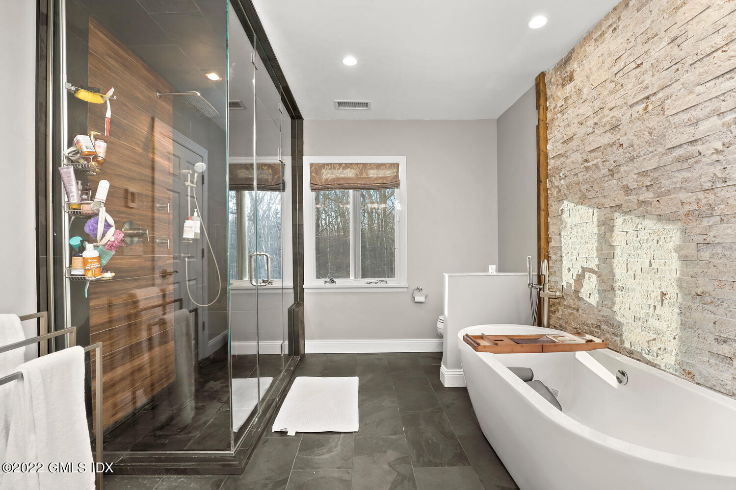 442 Riversville Road Greenwich, CT 06831 - Photo 14 of 29 a bathroom with a bathtub a toilet and a shower