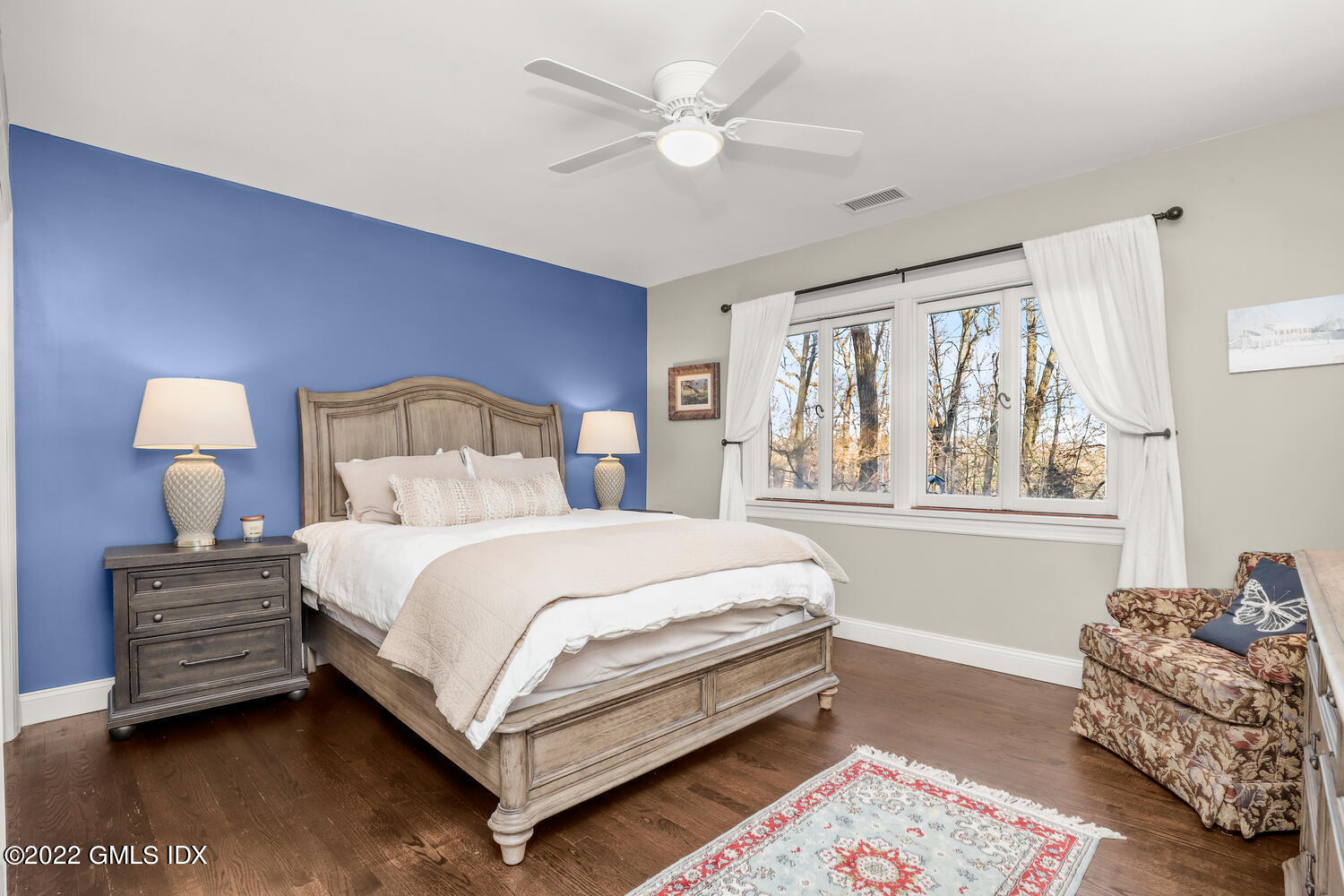 442 Riversville Road Greenwich, CT 06831 - Photo 17 of 29 a bedroom with a bed couch and a window