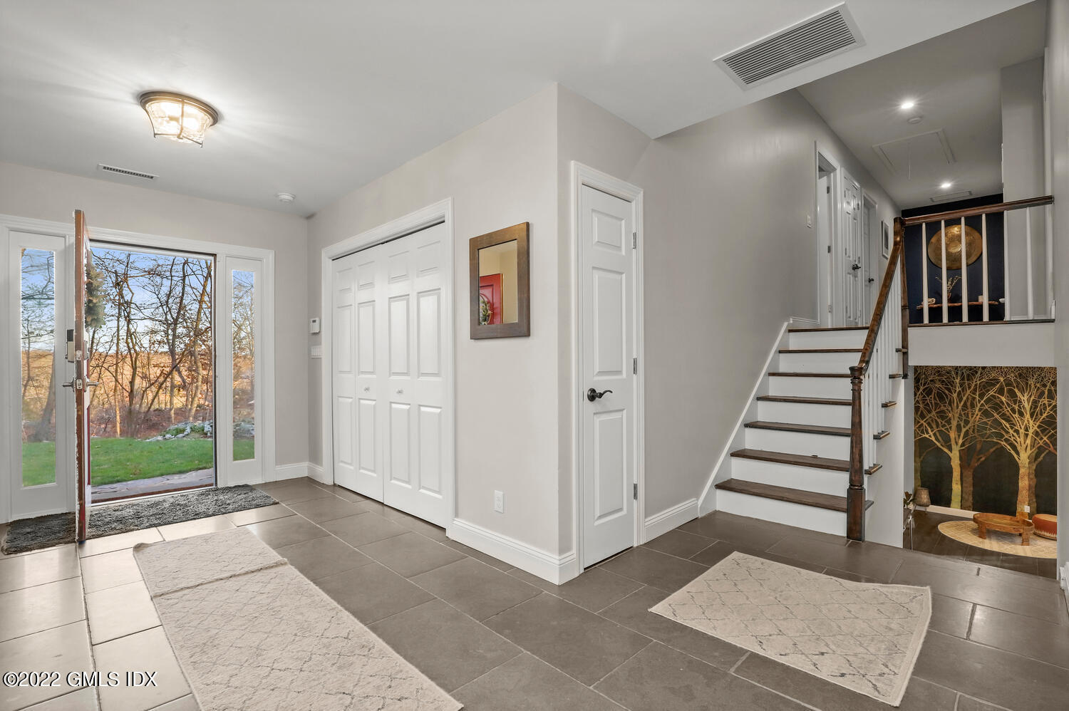 442 Riversville Road Greenwich, CT 06831 - Photo 2 of 29 a view of entryway with stairs and wooden floor