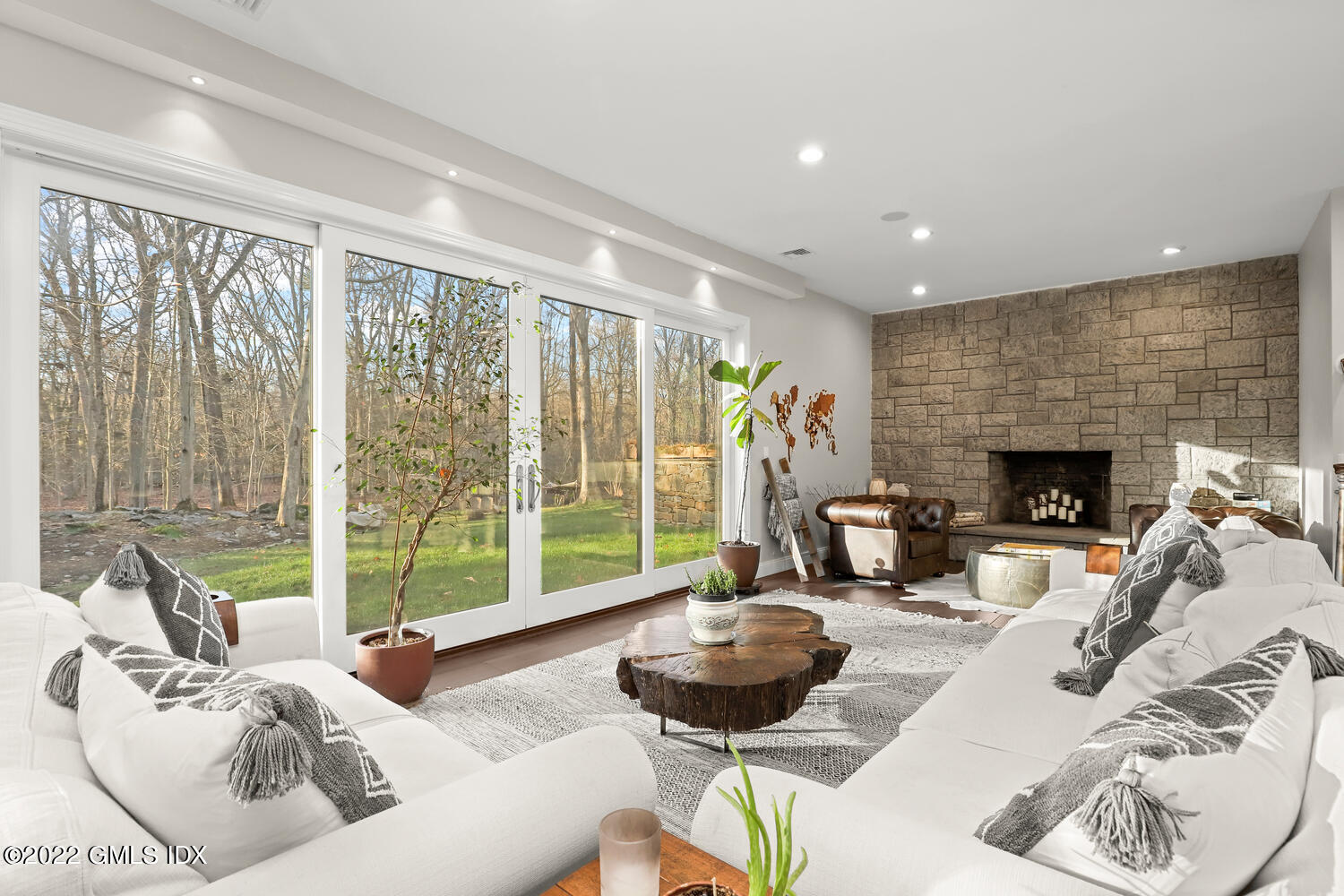 442 Riversville Road Greenwich, CT 06831 - Photo 21 of 29 a living room with furniture and a fireplace