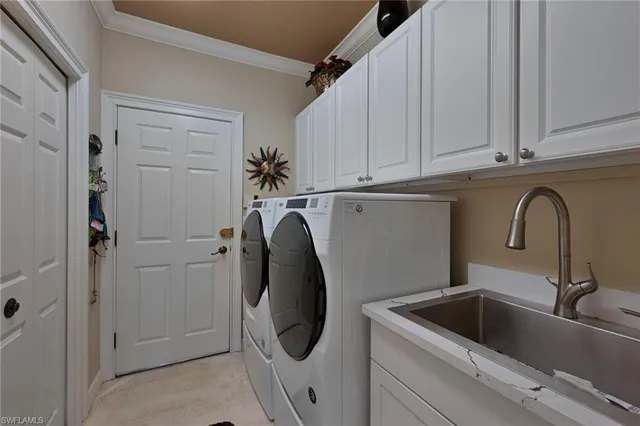 a close view of a sink and dishwasher in a kitchen