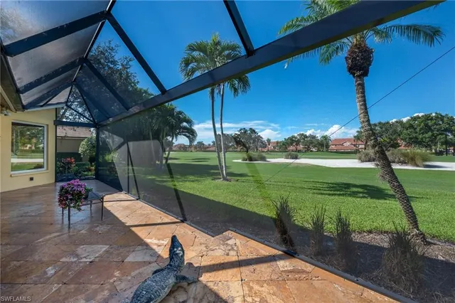 a view of a backyard with sitting area