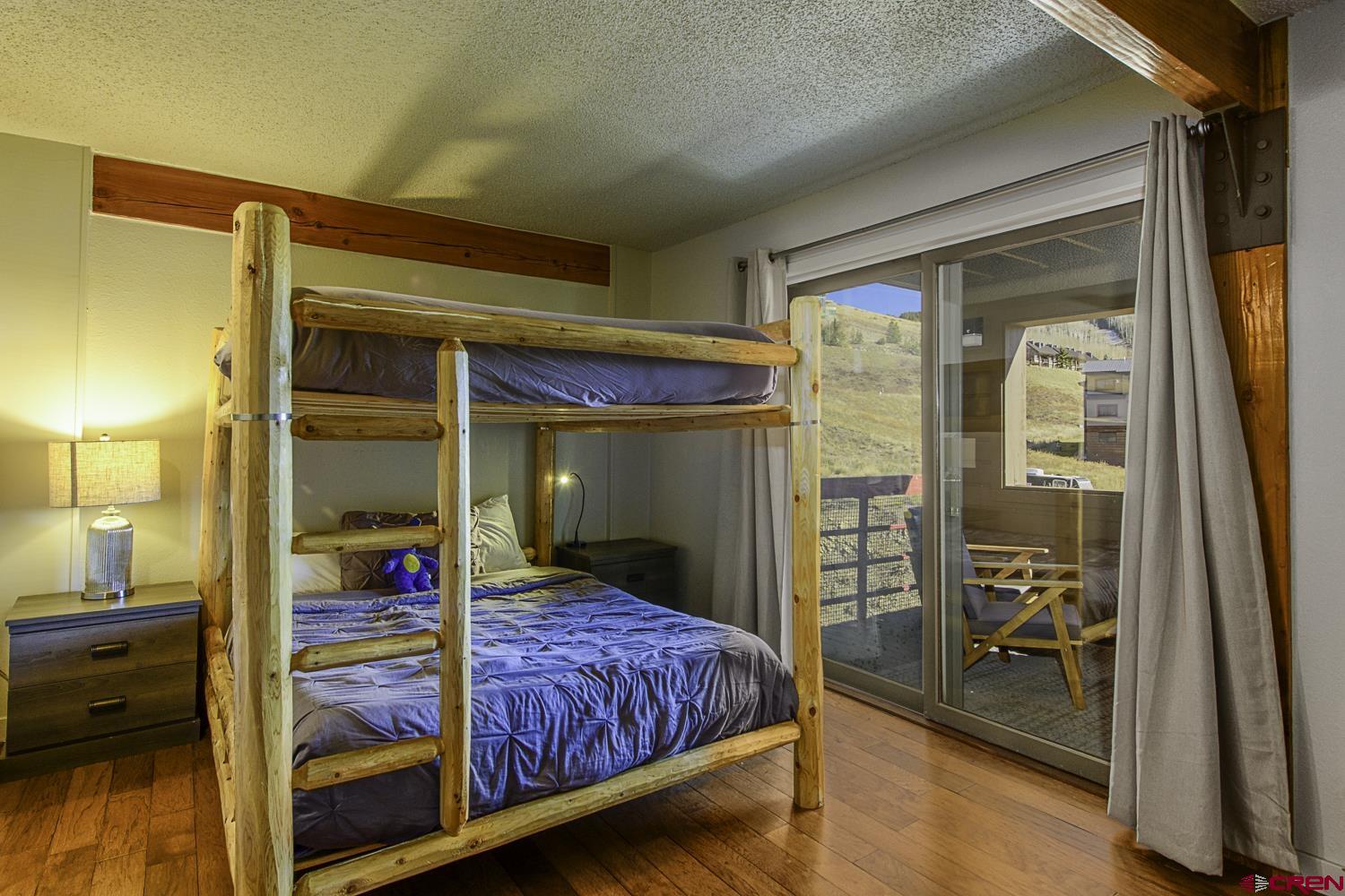25 Emmons Road, Unit 37 Crested Butte, CO 81225 - Photo 20 of 28 a bedroom with a bed and a view of bedroom