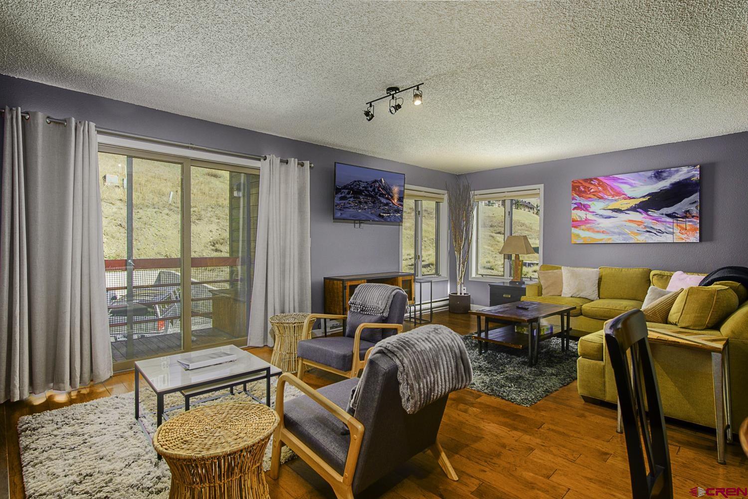 25 Emmons Road, Unit 37 Crested Butte, CO 81225 - Photo 4 of 28 a living room with furniture a rug and a window