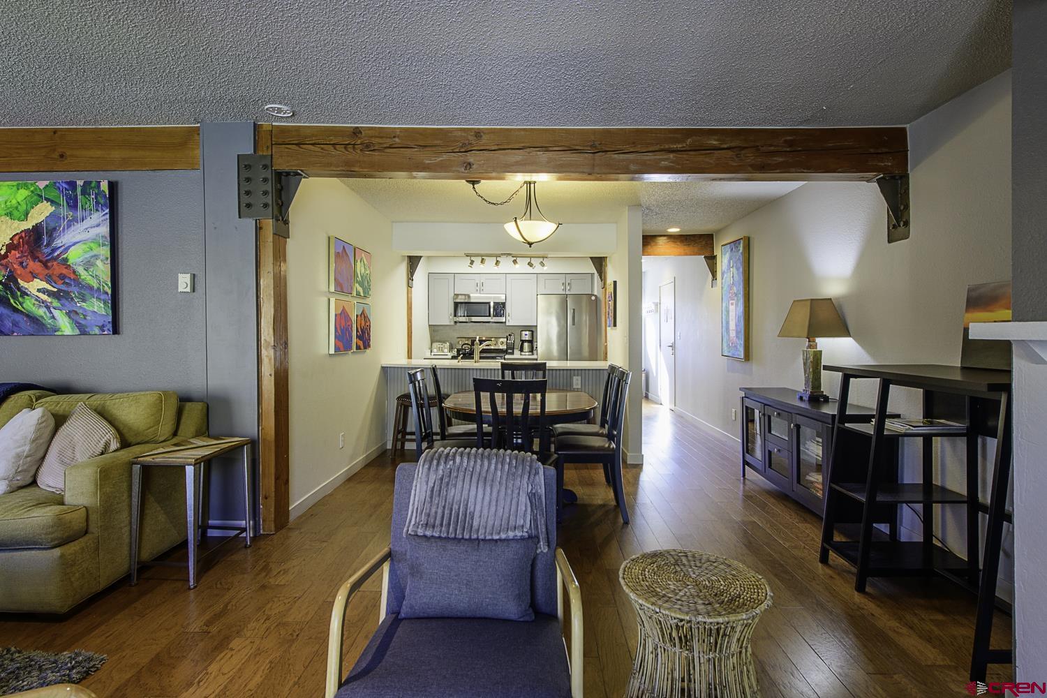 25 Emmons Road, Unit 37 Crested Butte, CO 81225 - Photo 6 of 28 a living room with furniture and a wooden floor