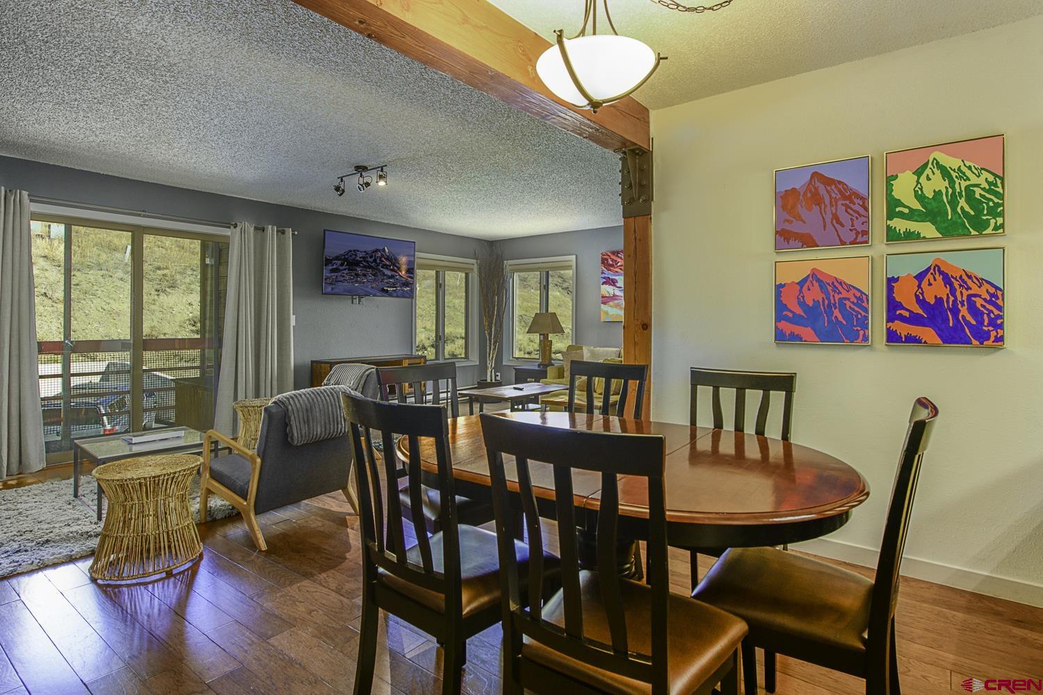 25 Emmons Road, Unit 37 Crested Butte, CO 81225 - Photo 7 of 28 a view of a dining room with furniture window and outside view
