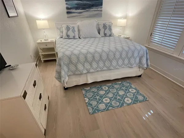 a bedroom with a bed and a cabinets