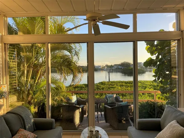 a living room filled with furniture and a window