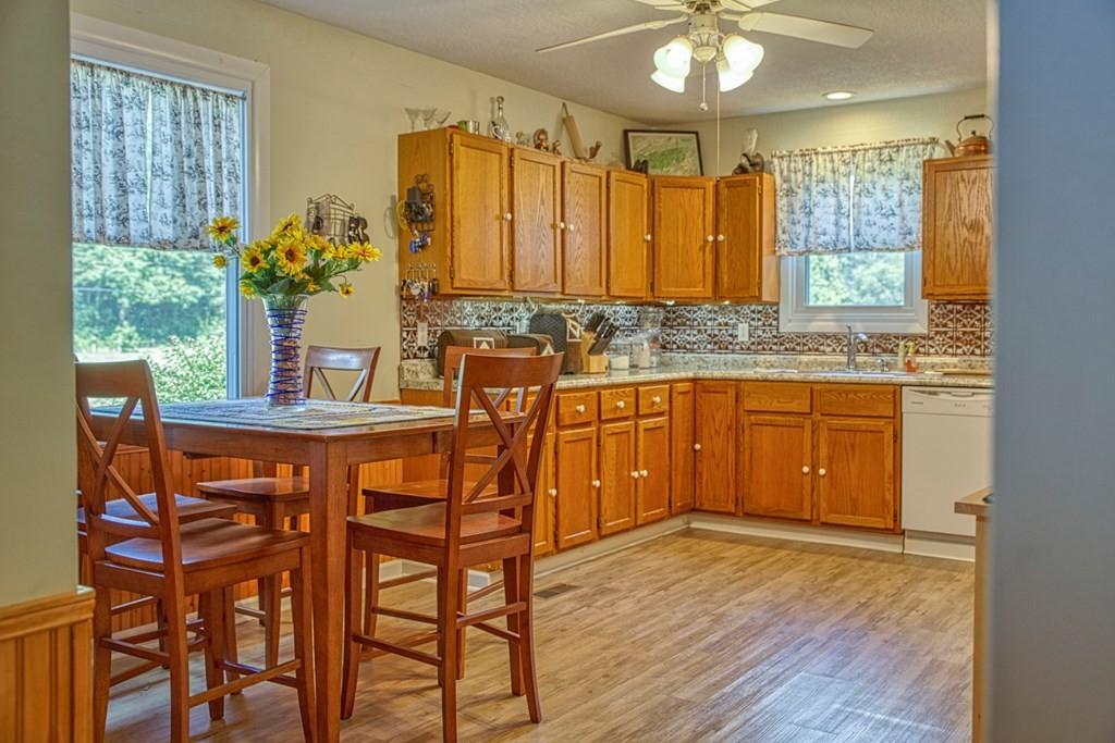 1383 Morrison Creek Road Gainesboro, TN 38562 - Photo 15 of 22 a dining hall with a sink and dishwasher with wooden floor