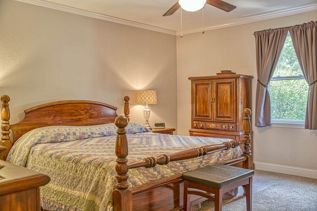 1383 Morrison Creek Road Gainesboro, TN 38562 - Photo 16 of 22 a bedroom with a bed and wooden floor