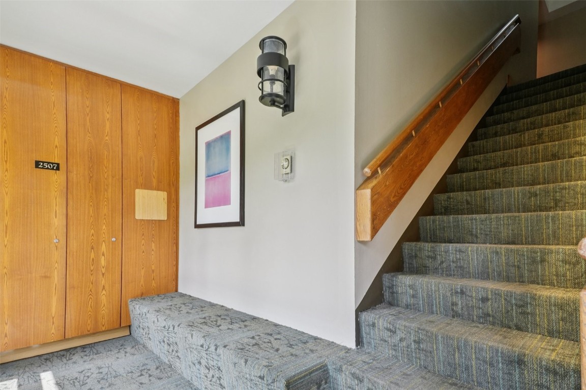 22097 Saints John Road, Unit 2506 Keystone, CO 80435 - Photo 27 of 47 Stairs with carpet