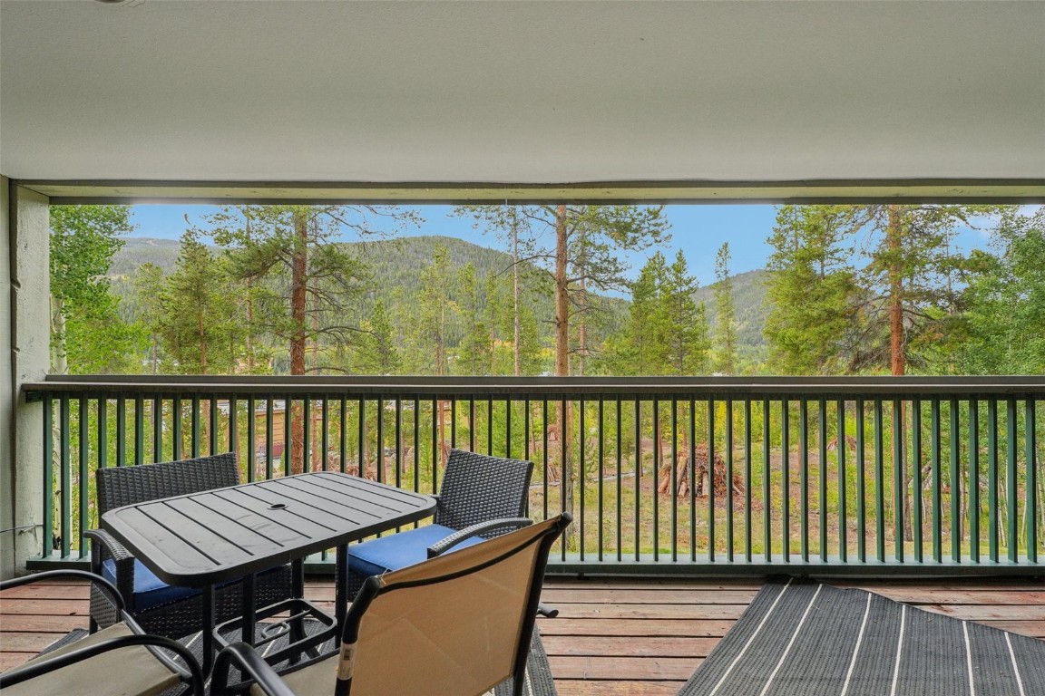 22097 Saints John Road, Unit 2506 Keystone, CO 80435 - Photo 30 of 47 Sunroom featuring a mountain view and view of scattered trees