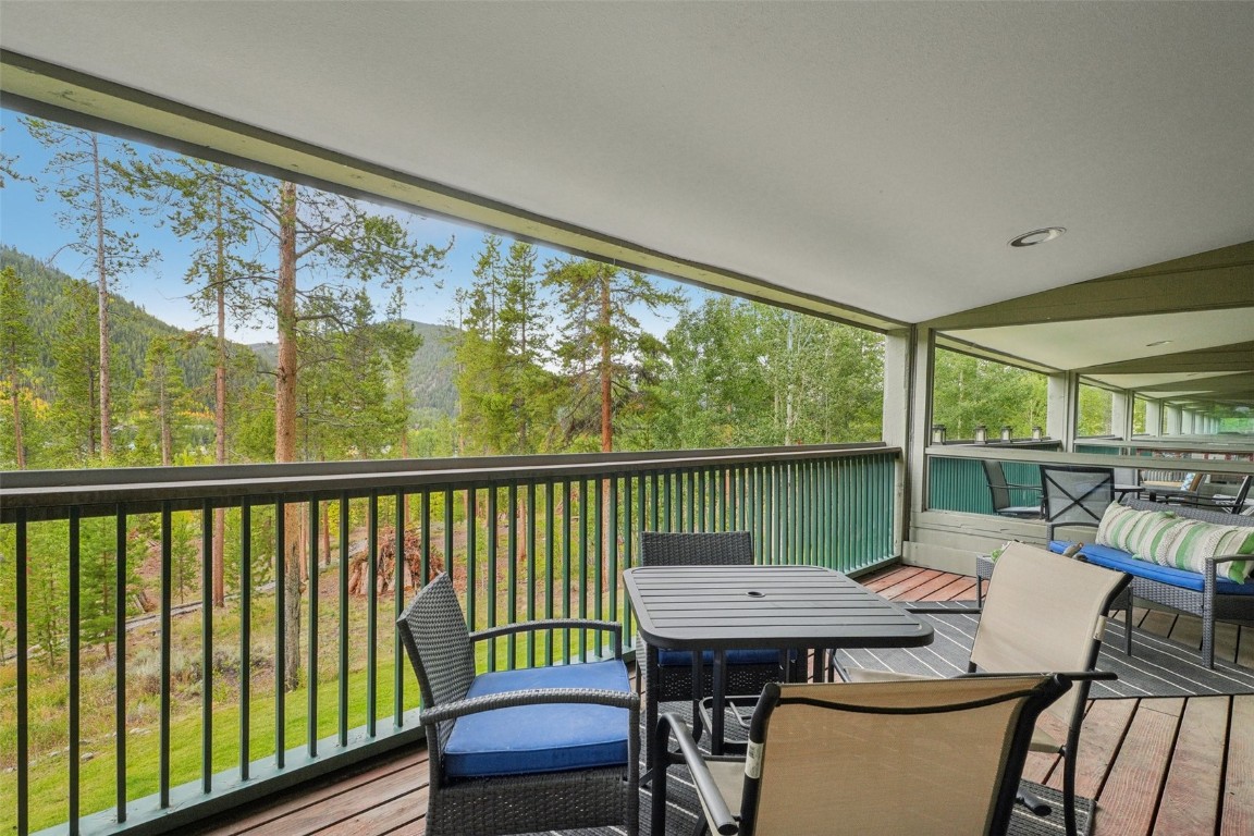 22097 Saints John Road, Unit 2506 Keystone, CO 80435 - Photo 31 of 47 Sunroom / solarium with outdoor dining area, lofted ceiling, and a balcony