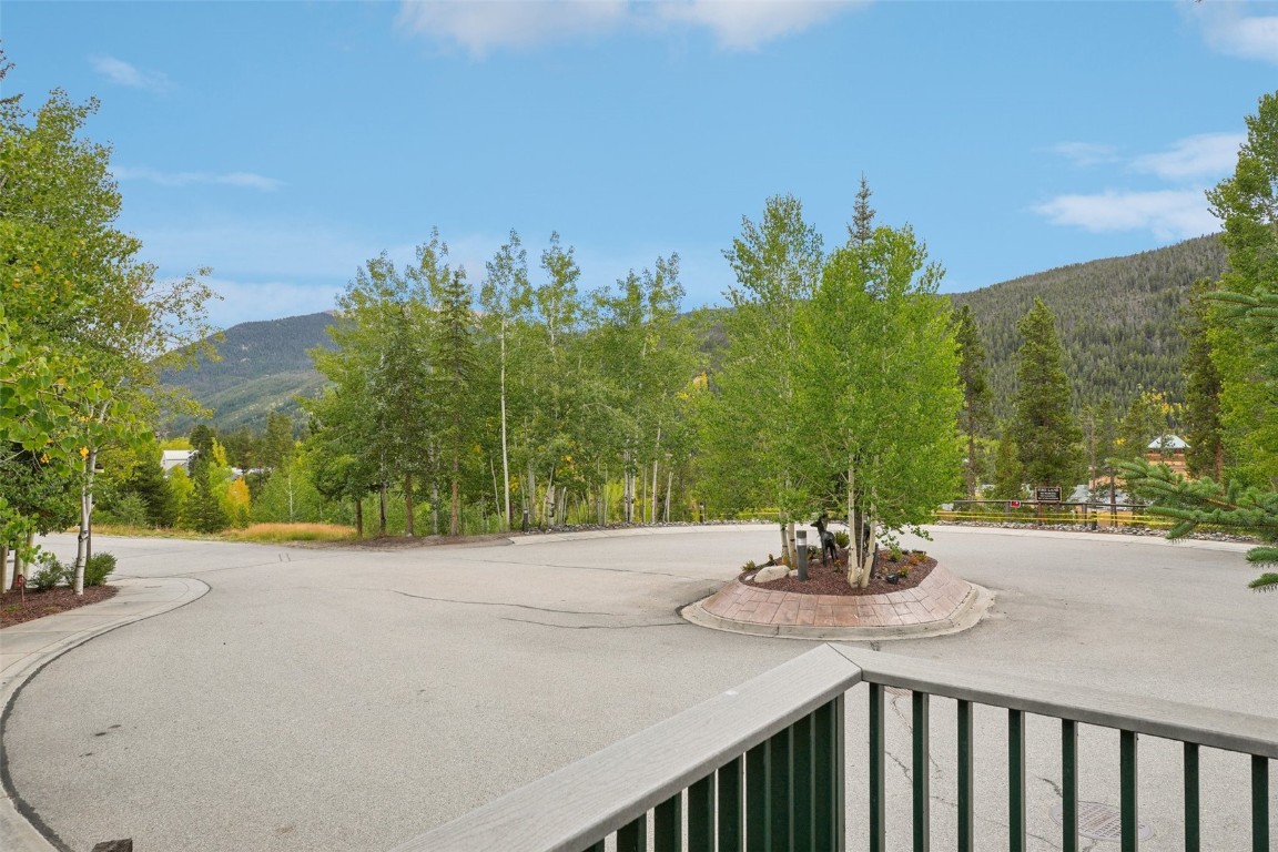 22097 Saints John Road, Unit 2506 Keystone, CO 80435 - Photo 34 of 47 View of asphalt street featuring a mountain view, sidewalks, and a view of trees