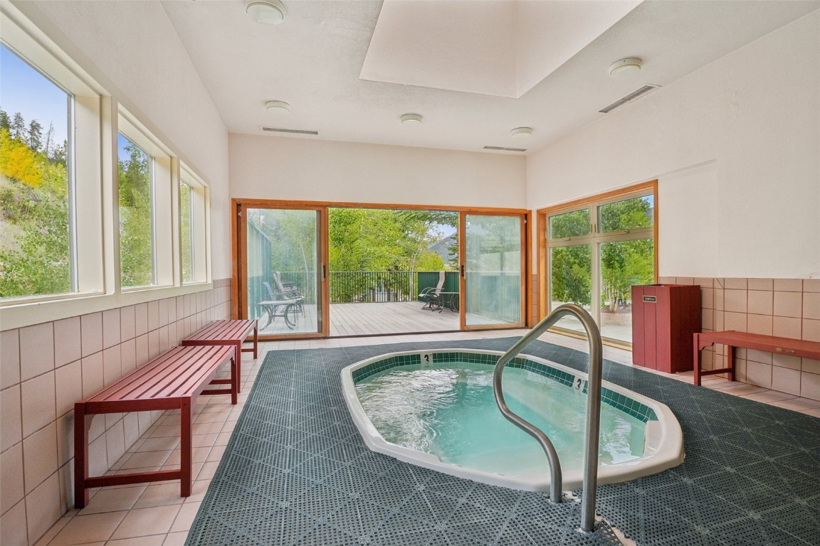 22097 Saints John Road, Unit 2506 Keystone, CO 80435 - Photo 46 of 47 View of pool with a sunroom and a hot tub