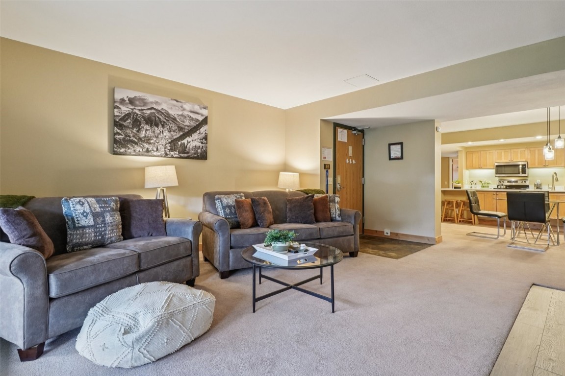 22097 Saints John Road, Unit 2506 Keystone, CO 80435 - Photo 7 of 47 Living room with carpet flooring