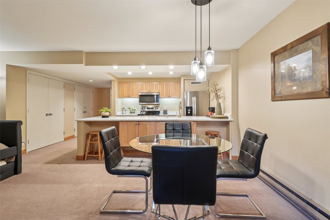 22097 Saints John Road, Unit 2506 Keystone, CO 80435 - Photo 8 of 47 Dining area featuring a baseboard heating unit, light carpet, and recessed lighting