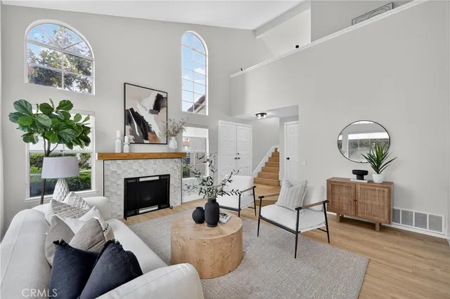 a living room with furniture and a fireplace