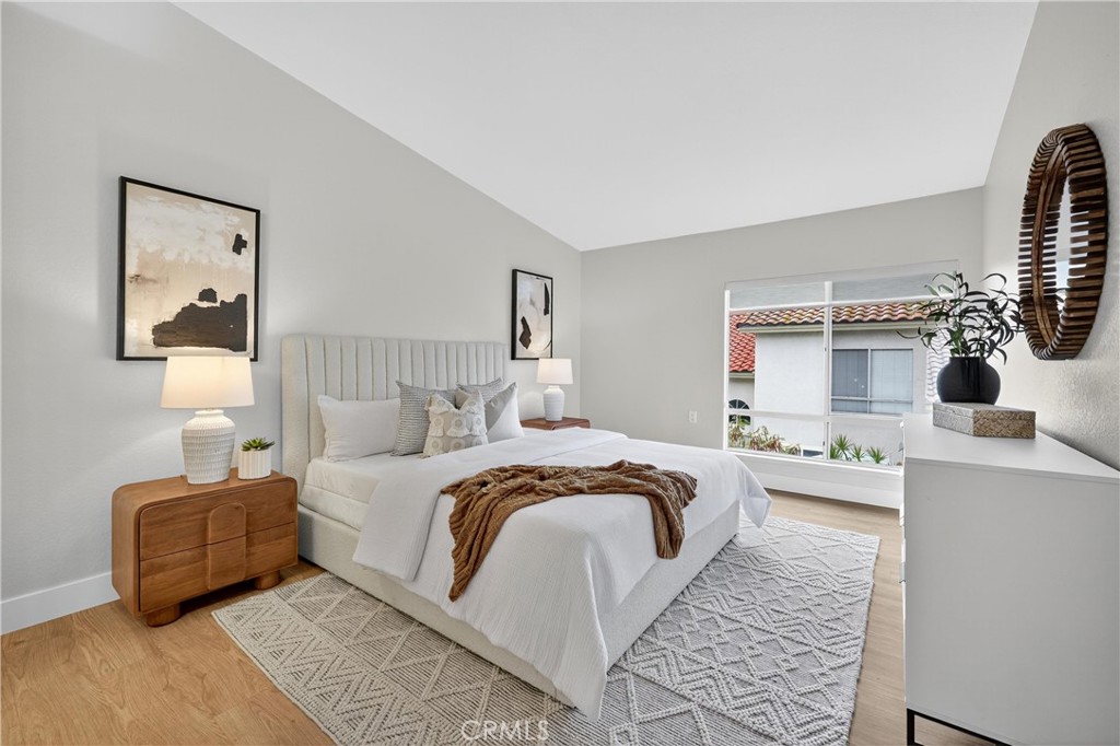 29 Carnation, Unit 64 Rancho Santa Margarita, CA 92688 - Photo 12 of 38 a bedroom with double bed and a window