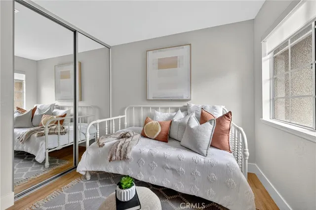 a bedroom with a bed and window