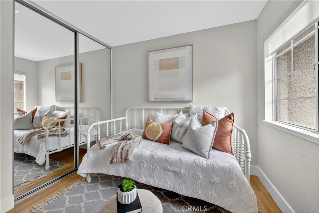 29 Carnation, Unit 64 Rancho Santa Margarita, CA 92688 - Photo 18 of 38 a bedroom with a bed and window