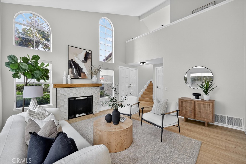 29 Carnation, Unit 64 Rancho Santa Margarita, CA 92688 - Photo 2 of 38 a living room with furniture and a fireplace