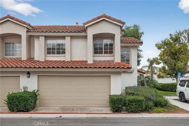 a front view of a house with garage