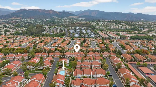 an aerial view of residential houses and city view