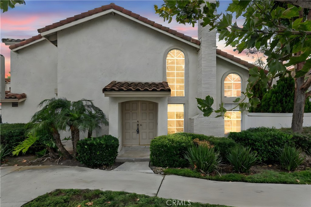 29 Carnation, Unit 64 Rancho Santa Margarita, CA 92688 - Photo 29 of 38 a front view of a house with garden