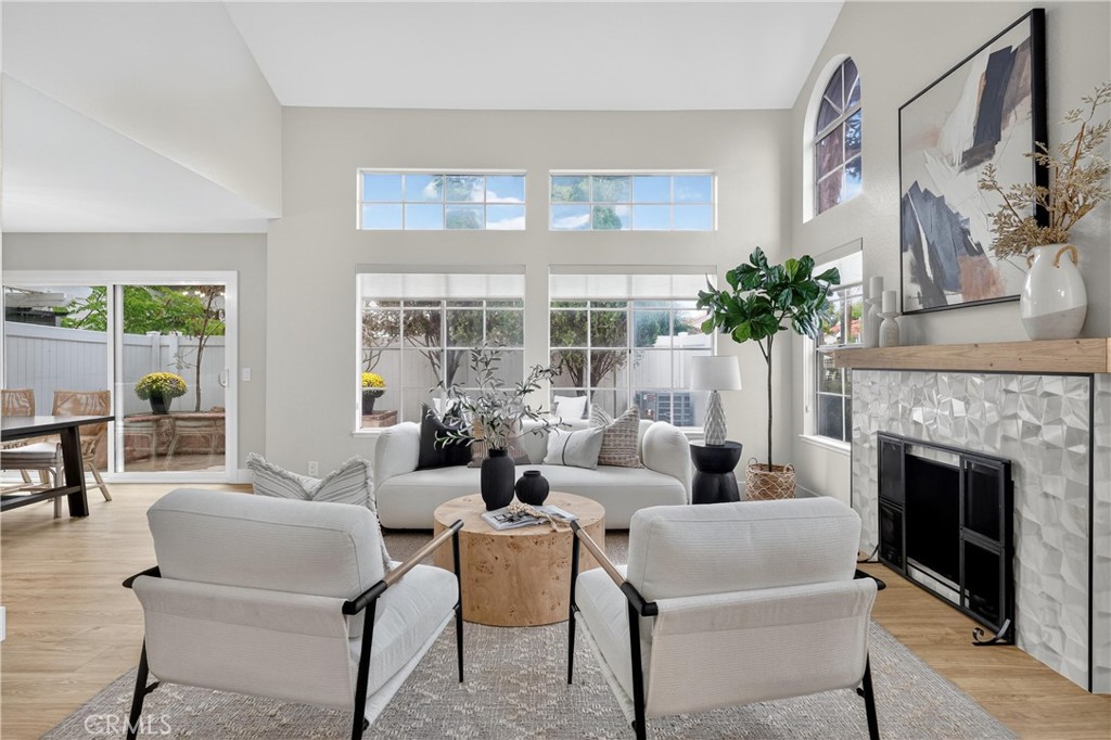 29 Carnation, Unit 64 Rancho Santa Margarita, CA 92688 - Photo 3 of 38 a living room with furniture and a fireplace