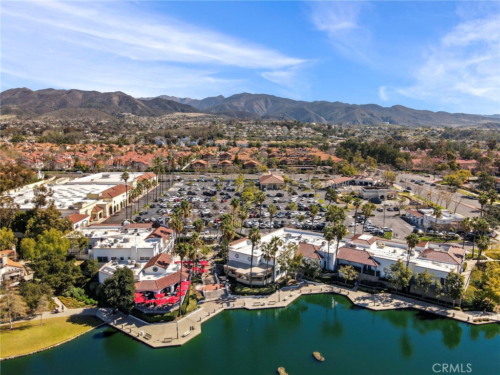 29 Carnation, Unit 64 Rancho Santa Margarita, CA 92688 - Photo 38 of 38 an aerial view of a city with lots of residential buildings ocean and mountain view in back