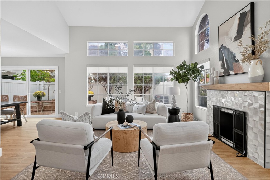 29 Carnation, Unit 64 Rancho Santa Margarita, CA 92688 - Photo 4 of 38 a living room with furniture and a fireplace