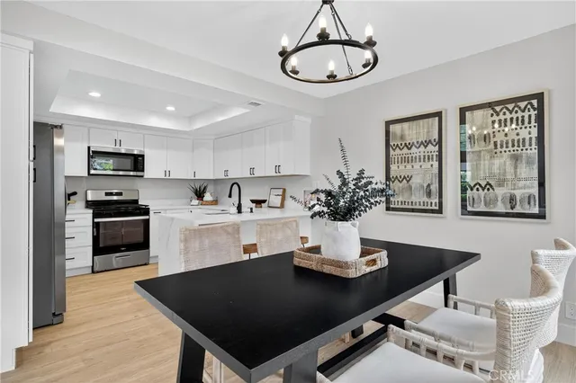 a kitchen with a dining table and chairs