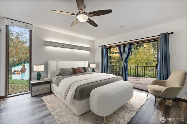 a spacious bedroom with a bed and a large window