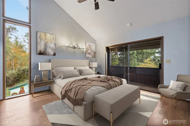 a bedroom with a bed and glass window