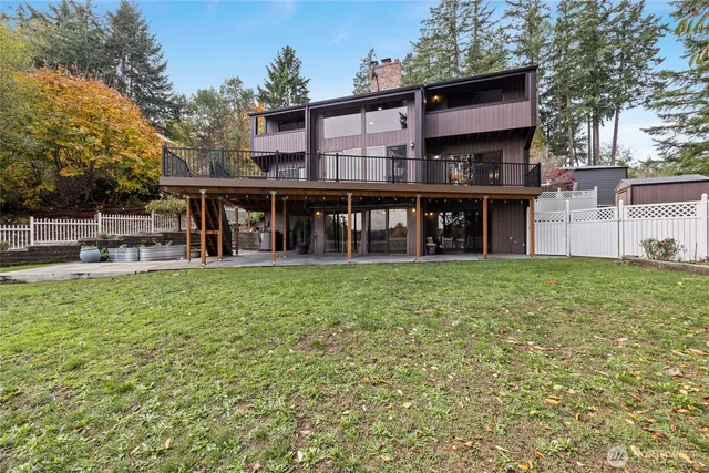 a view of a house with a backyard porch and sitting area