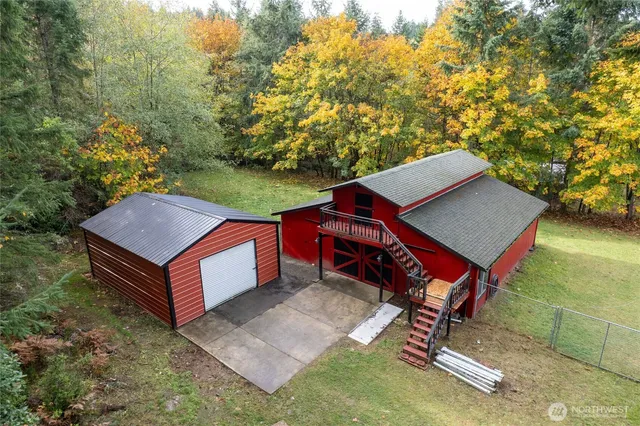 a view of a backyard with a patio and a yard
