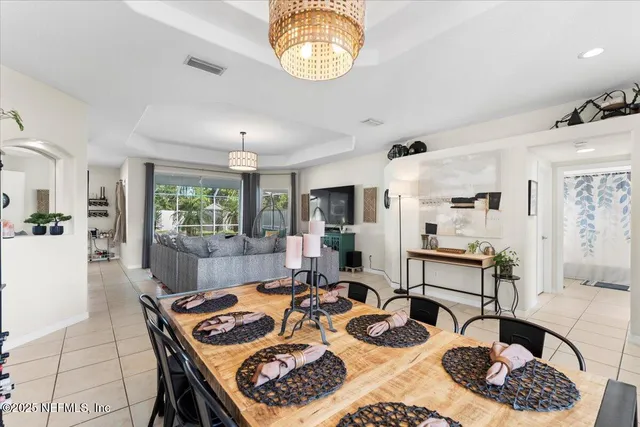 a kitchen with granite countertop a sink and white cabinets