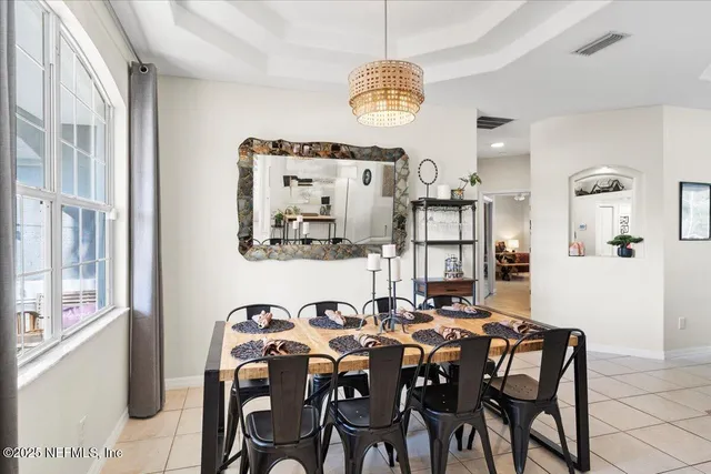 a kitchen with stainless steel appliances a sink and a refrigerator
